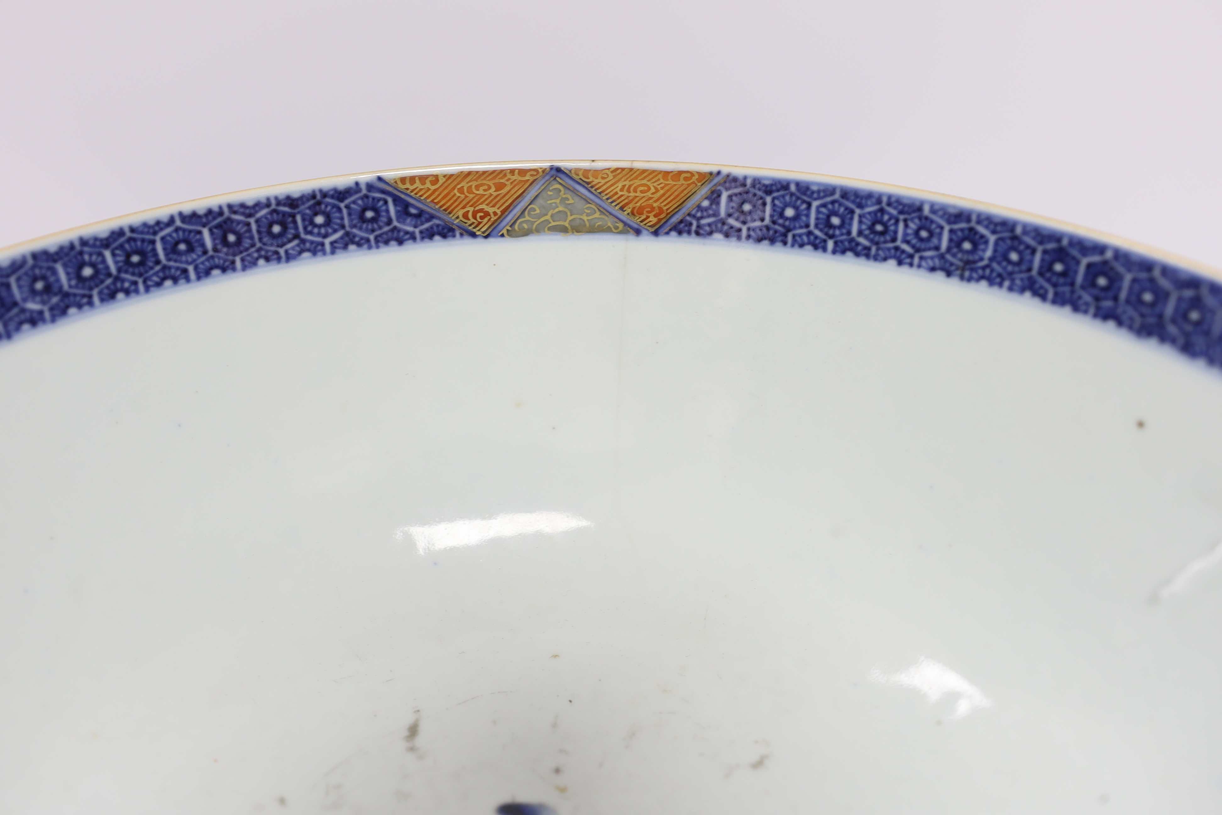 A large 18th century Chinese Export porcelain bowl, on associated stand, 28cm diameter